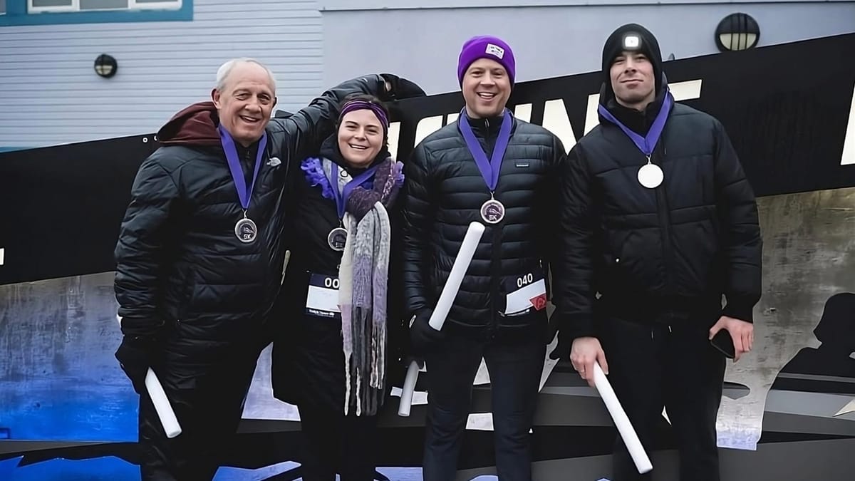 Four participants wearing medals after a foundation walk